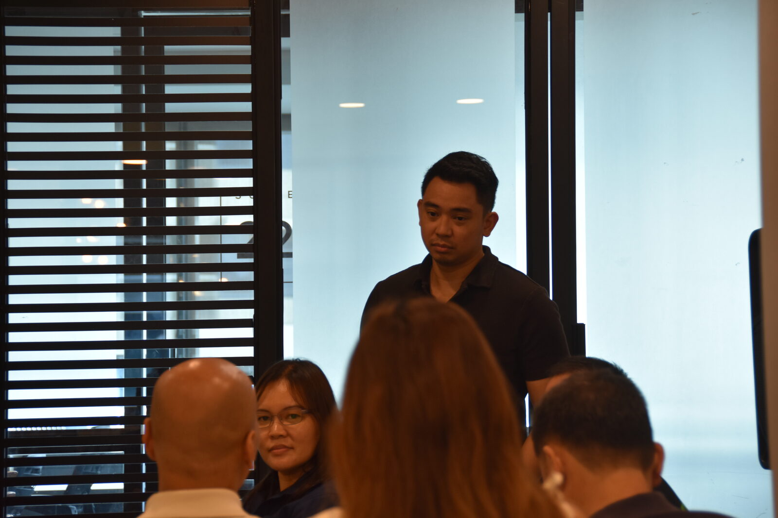 The trainer answering a question between sessions